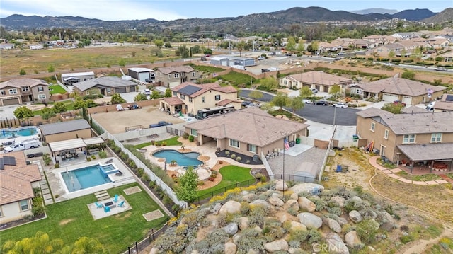 bird's eye view with a residential view and a mountain view