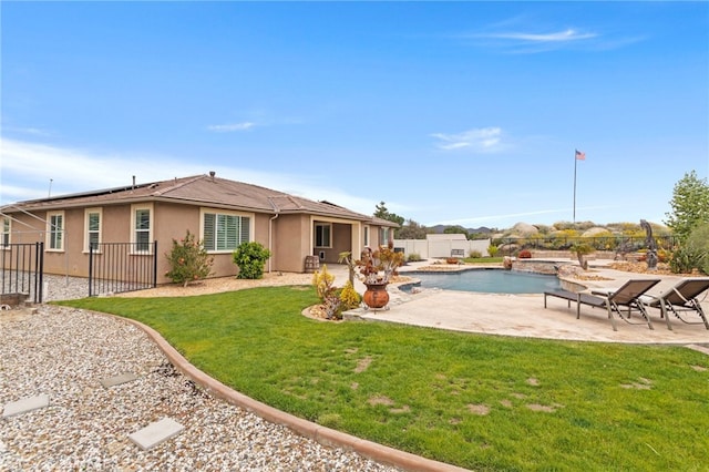 30404 Canyon Point Cir, Menifee, CA 92584 - back of property with stucco siding, a patio, solar panels, and a fenced backyard