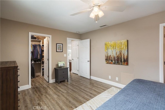 26872 Vista Del Mar, Dana Point, CA 92624 - bedroom featuring baseboards, a spacious closet, wood finished floors, and visible vents