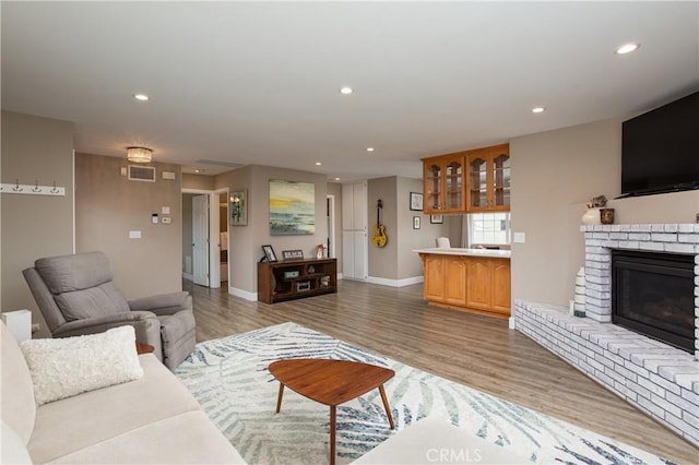 26872 Vista Del Mar, Dana Point, CA 92624 - living area with light wood finished floors, a fireplace, recessed lighting, baseboards, and visible vents