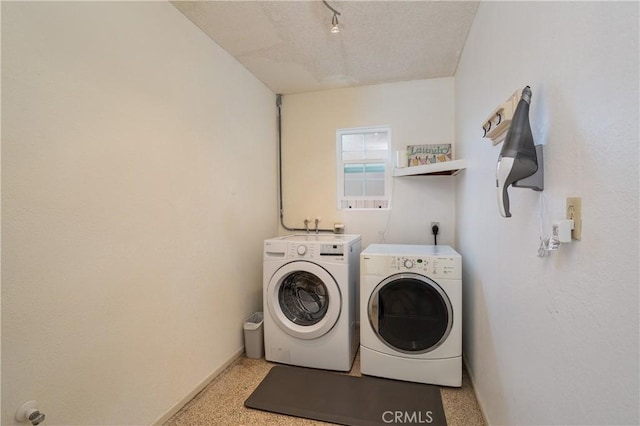 26872 Vista Del Mar, Dana Point, CA 92624 - clothes washing area featuring baseboards, laundry area, washing machine and dryer, and a textured ceiling