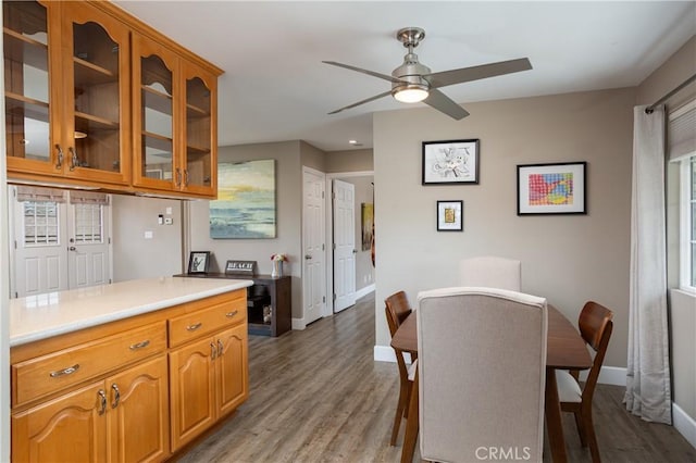 26872 Vista Del Mar, Dana Point, CA 92624 - kitchen featuring glass insert cabinets, baseboards, light wood-style flooring, and light countertops