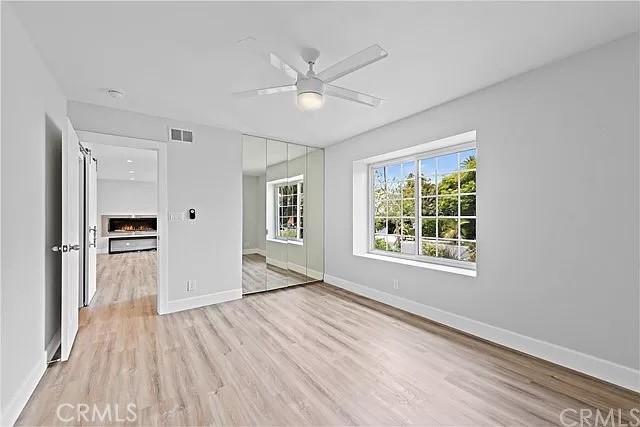 26872 Vista Del Mar, Dana Point, CA 92624 - unfurnished bedroom with baseboards, ceiling fan, light wood-type flooring, and visible vents