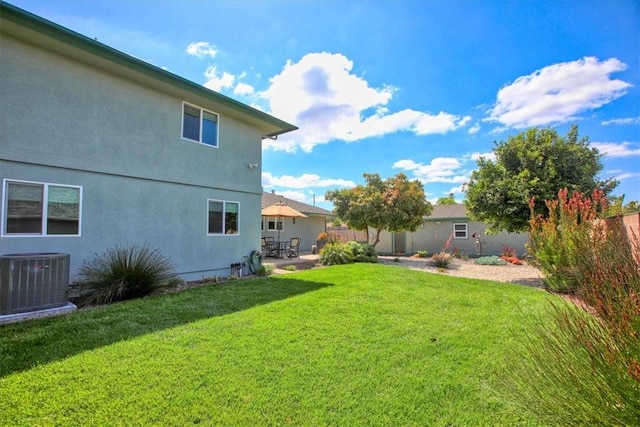 view of yard featuring a patio area, fence, and cooling unit