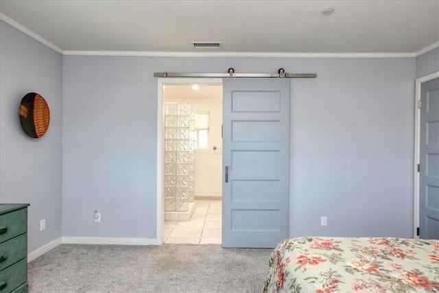 carpeted bedroom with baseboards, ornamental molding, a barn door, and visible vents