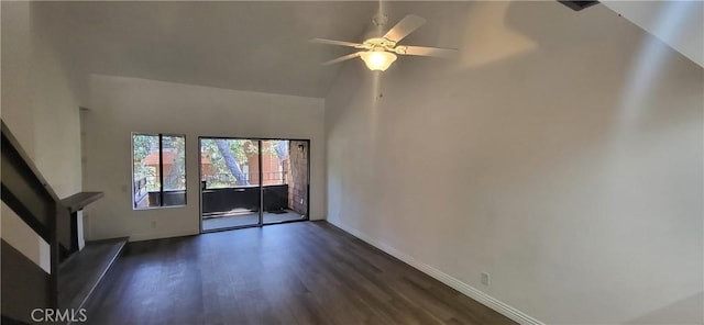 unfurnished living room featuring baseboards, a ceiling fan, and dark wood-type flooring