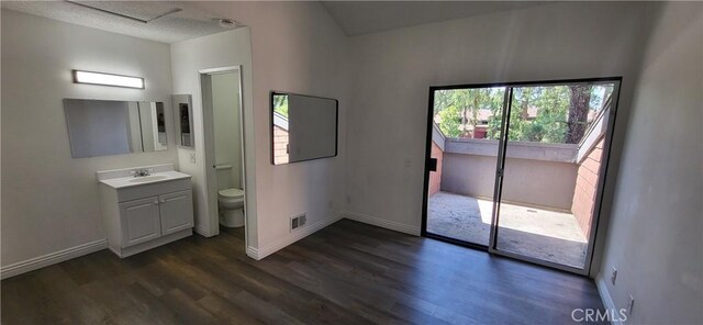 unfurnished bedroom with dark wood-type flooring, baseboards, and visible vents