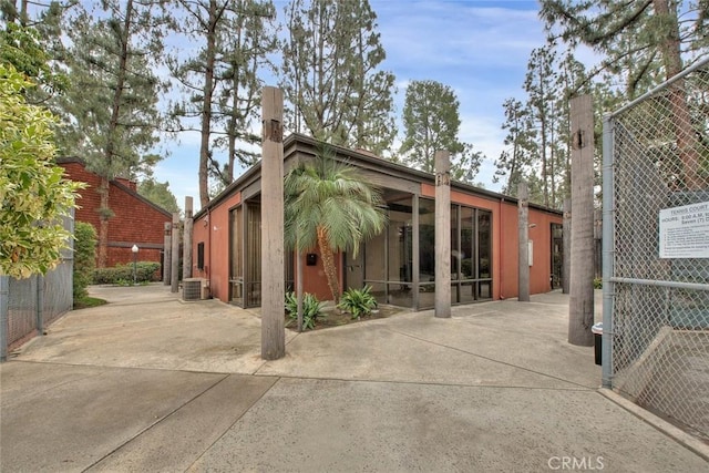 348 S Prospectors Rd Unit 8, Diamond Bar, CA 91765 - rear view of house featuring fence, central air condition unit, and a patio area