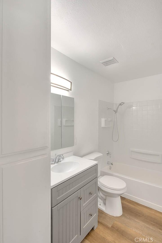 348 S Prospectors Rd Unit 8, Diamond Bar, CA 91765 - full bathroom with toilet, shower / tub combination, vanity, wood finished floors, and a textured ceiling
