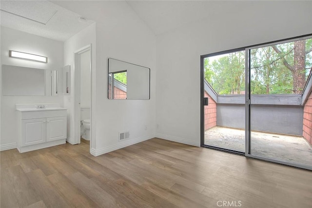 348 S Prospectors Rd Unit 8, Diamond Bar, CA 91765 - unfurnished room with light wood-type flooring, baseboards, vaulted ceiling, and a sink