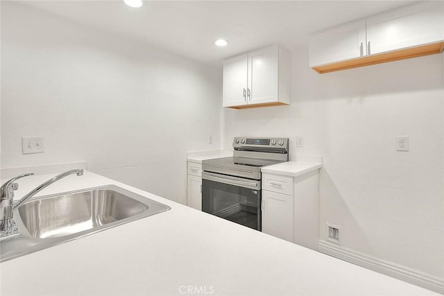 348 S Prospectors Rd Unit 8, Diamond Bar, CA 91765 - kitchen featuring electric range, a sink, light countertops, white cabinetry, and recessed lighting