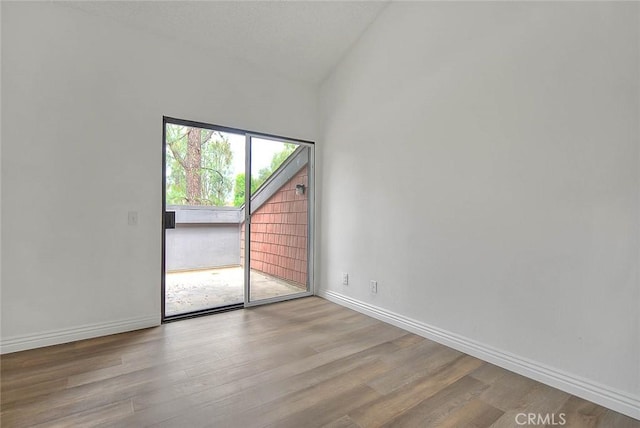 348 S Prospectors Rd Unit 8, Diamond Bar, CA 91765 - spare room featuring wood finished floors, lofted ceiling, and baseboards