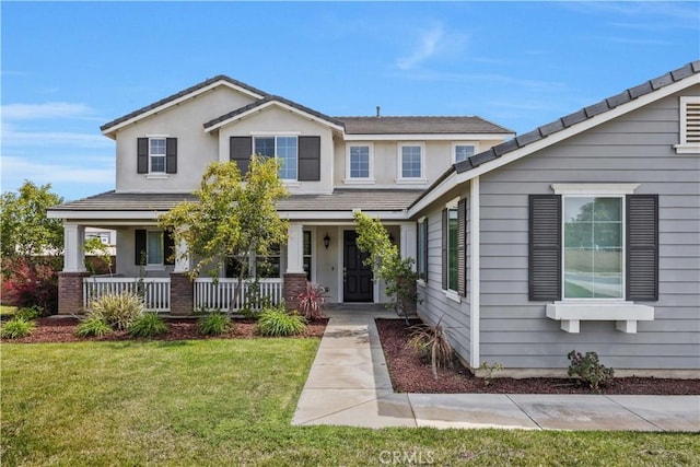 view of front of property featuring a porch and a front lawn