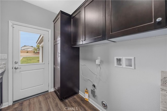 laundry room with baseboards, cabinet space, dark wood-style flooring, and washer hookup