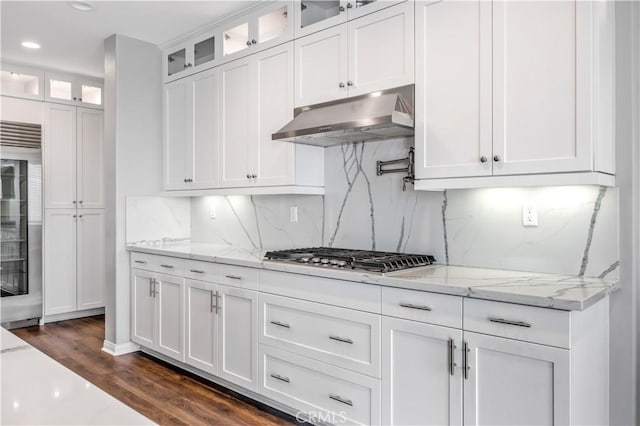 kitchen featuring stainless steel appliances, white cabinets, and under cabinet range hood