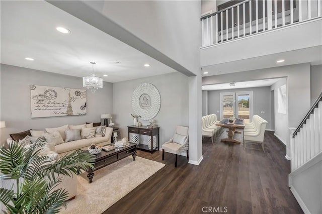 living room with recessed lighting, a chandelier, dark wood-style floors, and stairway