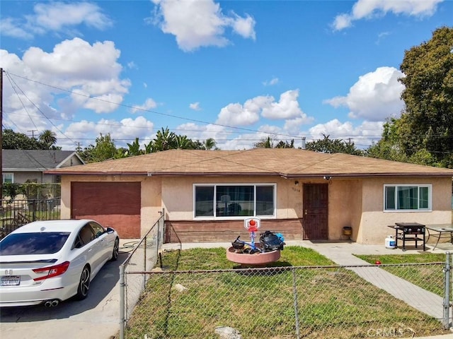ranch-style house featuring a shingled roof, stucco siding, fence private yard, and a front yard