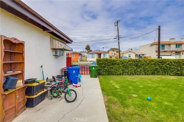 view of yard with fence and a residential view