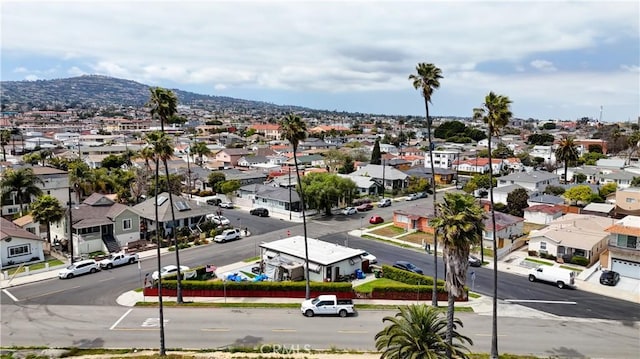 drone / aerial view with a residential view and a mountain view