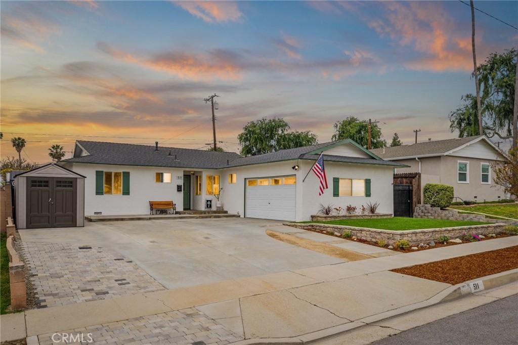 511 Mariposa St, La Habra, CA 90631 - ranch-style home featuring stucco siding, concrete driveway, and an attached garage