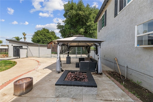 15064 Marcolesco St, Lake Elsinore, CA 92530 - view of patio featuring a gazebo, fence, and a fire pit