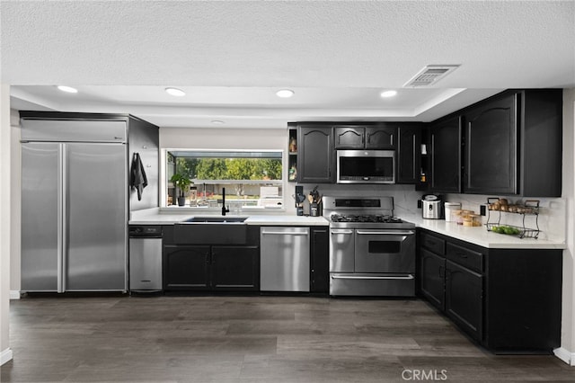 15064 Marcolesco St, Lake Elsinore, CA 92530 - kitchen featuring a sink, light countertops, stainless steel appliances, and visible vents
