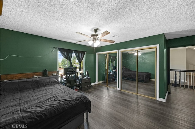 15064 Marcolesco St, Lake Elsinore, CA 92530 - bedroom with visible vents, wood finished floors, two closets, baseboards, and a textured ceiling