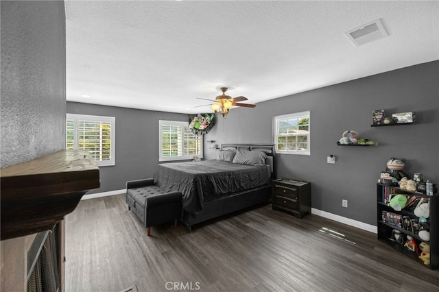 15064 Marcolesco St, Lake Elsinore, CA 92530 - bedroom with a textured ceiling, a ceiling fan, wood finished floors, and visible vents