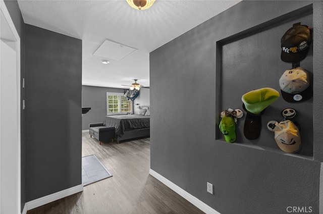 15064 Marcolesco St, Lake Elsinore, CA 92530 - hallway with baseboards, wood finished floors, and attic access