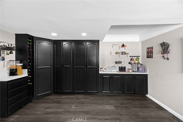 15064 Marcolesco St, Lake Elsinore, CA 92530 - bar with recessed lighting, baseboards, and dark wood finished floors