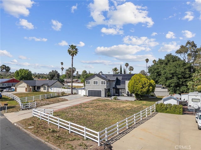 15064 Marcolesco St, Lake Elsinore, CA 92530 - view of front of house featuring a front lawn, fence, an attached garage, driveway, and a residential view