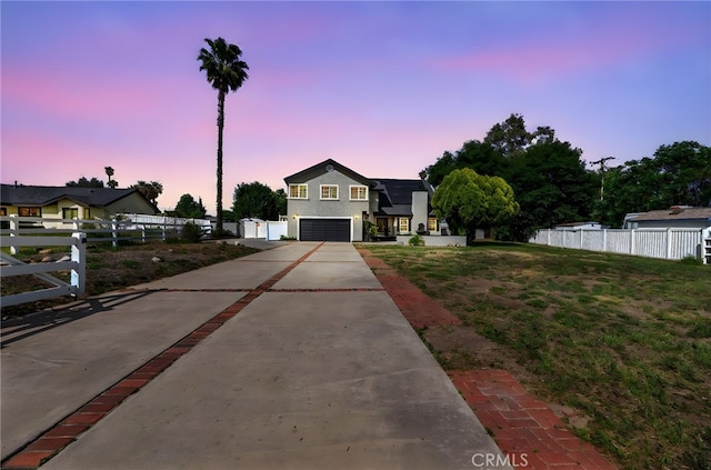 15064 Marcolesco St, Lake Elsinore, CA 92530 - view of front facade featuring a garage, a front lawn, fence, and driveway