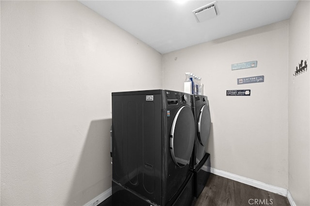 15064 Marcolesco St, Lake Elsinore, CA 92530 - washroom with laundry area, independent washer and dryer, visible vents, baseboards, and dark wood-type flooring
