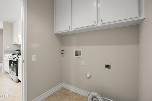 laundry area featuring cabinet space, light tile patterned flooring, washer hookup, baseboards, and hookup for an electric dryer