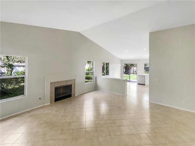 unfurnished living room featuring light tile patterned flooring, a fireplace, recessed lighting, baseboards, and lofted ceiling