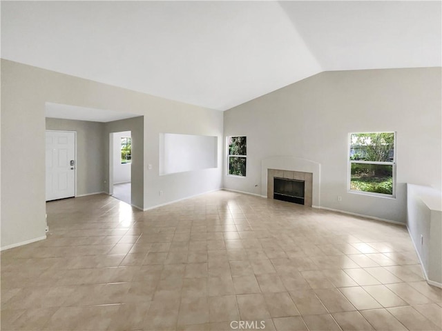 103 Buckthorn Way, Corona, CA 92881 - unfurnished living room featuring lofted ceiling, a fireplace, light tile patterned floors, and baseboards