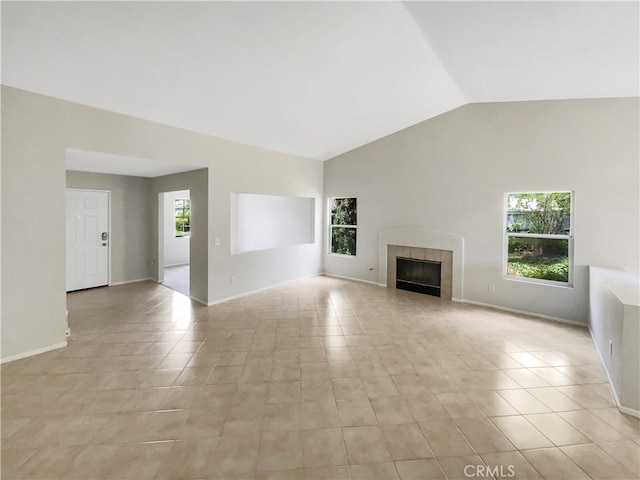 103 Buckthorn Way, Corona, CA 92881 - unfurnished living room with lofted ceiling, a tiled fireplace, and light tile patterned floors