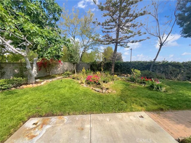 103 Buckthorn Way, Corona, CA 92881 - fenced backyard with a patio area