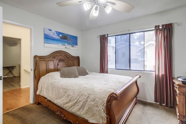 bedroom featuring a ceiling fan and light carpet