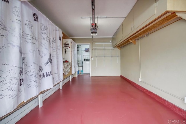 garage featuring washer / dryer and a garage door opener