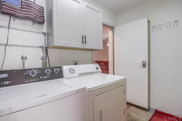 laundry room with cabinet space and washing machine and clothes dryer