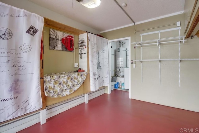 interior space with strapped water heater, finished concrete flooring, and baseboard heating