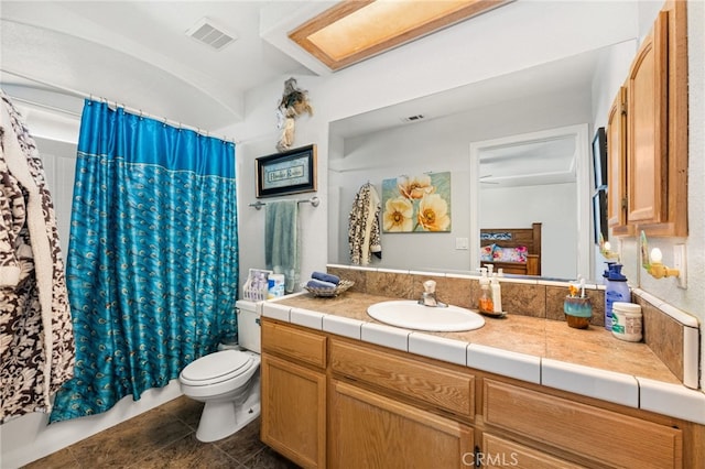 full bath with visible vents, shower / bathtub combination with curtain, toilet, and vanity