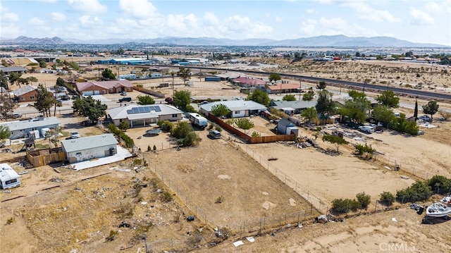aerial view featuring a mountain view and view of desert