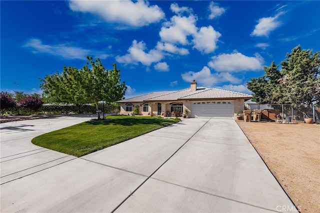 ranch-style home with driveway, a chimney, a front lawn, an attached garage, and stucco siding