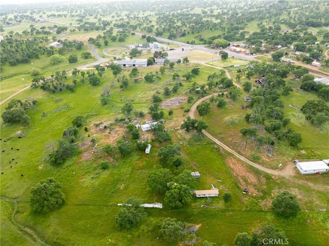 birds eye view of property with a rural view