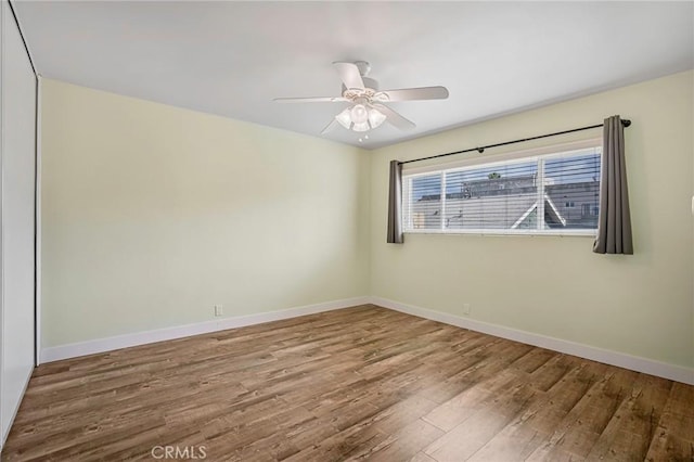 1130 E 1st St Unit 205, Long Beach, CA 90802 - empty room featuring baseboards, a ceiling fan, and wood finished floors