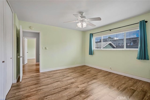 1130 E 1st St Unit 205, Long Beach, CA 90802 - empty room with baseboards, ceiling fan, and wood finished floors