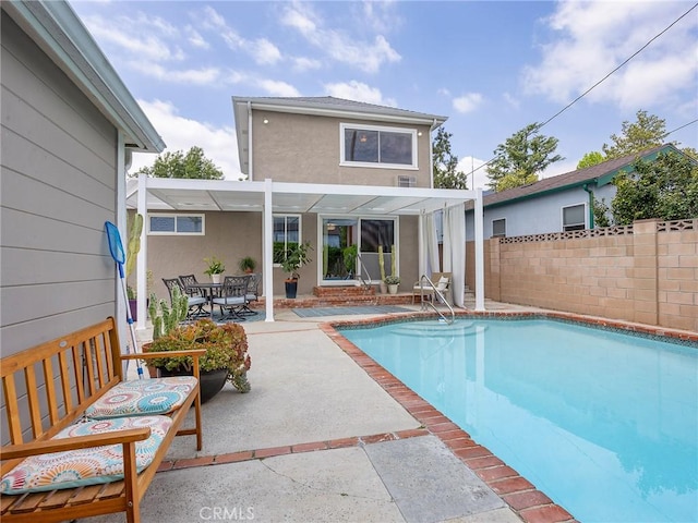 1234 N Pass Ave, Burbank, CA 91505 - back of property featuring fence, a pergola, stucco siding, a fenced in pool, and a patio area