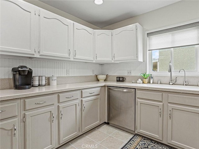 1234 N Pass Ave, Burbank, CA 91505 - kitchen with a sink, dishwasher, light countertops, white cabinetry, and light tile patterned floors